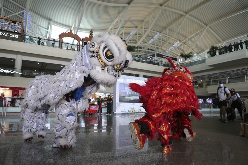 Virus Outbreak Indonesia Lunar New Year Chinese tourists arrive at Ngurah Rai international airport in Bali, Indonesia on Sunday, Jan. 22, 2023. A direct flight from China landed in Indonesia's resort island of Bali for the first time on Sunday in nearly three years after the route was cancelled due to the pandemic. (AP Photo/Firdia Lisnawati)