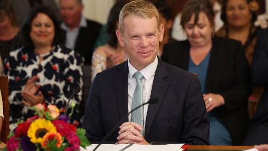 New Zealand's new Prime Minister Chris Hipkins smiles as he is sworn in by Governor General Dame Cindy Kiro during a ceremony at The Government House in Wellington on January 25, 2023. - Jacinda Ardern was officially replaced on January 25 as New Zealand prime minister, after stunning the country by announcing her abrupt departure from the role last week.
New Prime Minister Chris Hipkins, 44, was sworn in by New Zealand's governor-general during a ceremony in the capital, Wellington. (Photo by Marty MELVILLE / AFP)