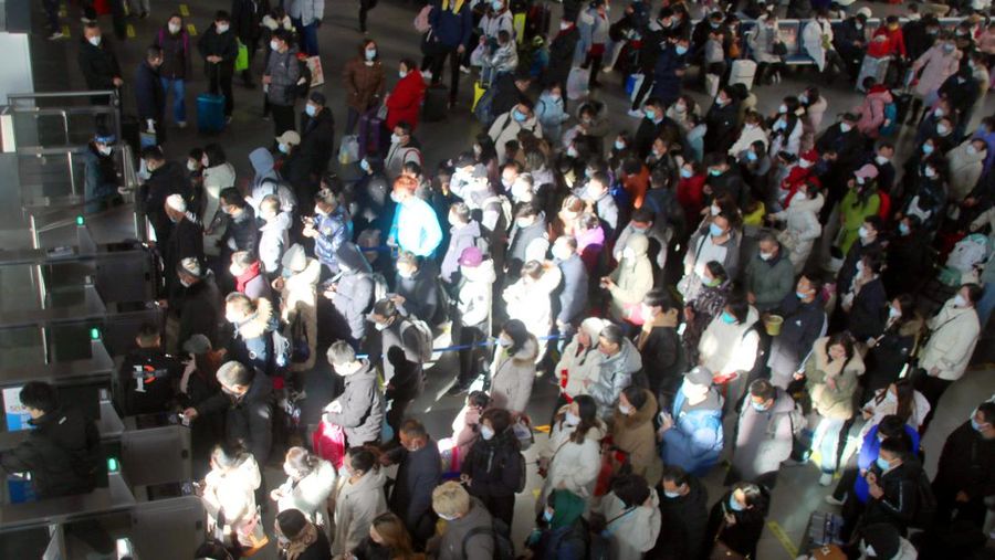 QINGZHOU, CHINA - JANUARY 27, 2023 - Many passengers wait at the waiting hall of Suzhou Railway Station in East China's Jiangsu province, Jan 27, 2023. According to the data center of the Ministry of Culture and Tourism, 308 million domestic trips were made during the Spring Festival holiday this year, up 23.1% year on year, recovering to 88.6% in the same period of 2019. Domestic tourism revenue reached 375.843 billion yuan, up 30% year on year, recovering to 73.1% in the same period of 2019. (Photo credit should read CFOTO/Future Publishing via Getty Images)