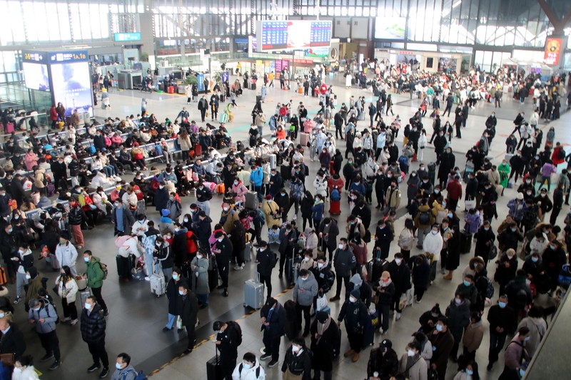 QINGZHOU, CHINA - JANUARY 27, 2023 - Many passengers wait at the waiting hall of Suzhou Railway Station in East China's Jiangsu province, Jan 27, 2023. According to the data center of the Ministry of Culture and Tourism, 308 million domestic trips were made during the Spring Festival holiday this year, up 23.1% year on year, recovering to 88.6% in the same period of 2019. Domestic tourism revenue reached 375.843 billion yuan, up 30% year on year, recovering to 73.1% in the same period of 2019. (Photo credit should read CFOTO/Future Publishing via Getty Images)