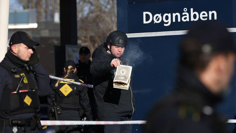 Far-right politician Rasmus Paludan burns a copy of Kuran in front of a mosque at Noerrebro, in Copenhagen, Denmark, Friday January 27, 2023. Ritzau Scanpix/Olafur Steinar Gestsson via REUTERS    ATTENTION EDITORS - THIS IMAGE WAS PROVIDED BY A THIRD PARTY. DENMARK OUT. NO COMMERCIAL OR EDITORIAL SALES IN DENMARK.
