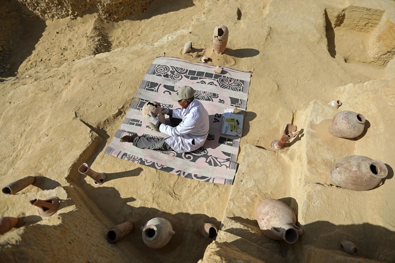 1459632878 CAIRO, EGYPT- JANUARY 26: Egyptian archaeological workers excavating the site of the Step Pyramid of Djoser in Saqqara during the announcement of new discoveries at the Director Bridge in Saqqara, on January 26, 2023 in Giza, Egypt. (Photo by Fadel Dawod/Getty Images)