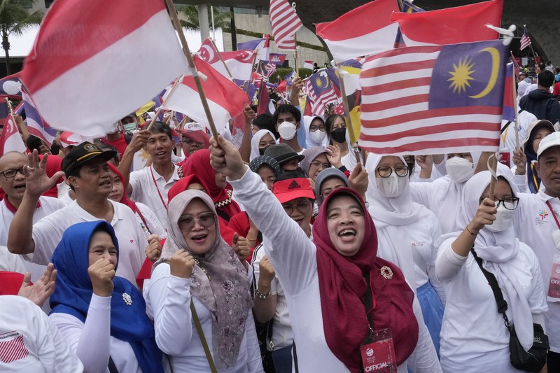 Indonesia Indonesian President Joko Widodo, center, bangs a drum during the opening ceremony of the Kick Off 2023 ASEAN Indonesian Chairmanship in Jakarta, Indonesia, Sunday, Jan. 29, 2023. Indonesia will chair the Association of Southeast Asian Nations, ASEAN, for 2023. (AP Photo/Achmad Ibrahim)