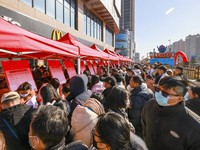 TAIZHOU, CHINA - JANUARY 29, 2023 - Job seekers look for suitable jobs at a job fair in Taizhou, East China's Jiangsu province, Jan 29, 2023. (Photo credit should read CFOTO/Future Publishing via Getty Images)