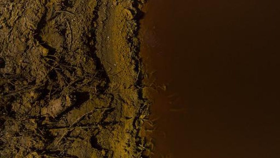 This aerial image shows the Gossan reservoir at the Riotinto mines in Minas de Riotinto, near of Huelva on September 30, 2022. - Although the Rio Tinto Company began to exploit these mines in 1873, this mining site already supplied minerals to the ancient Greeks and Romans. (Photo by JORGE GUERRERO / AFP)