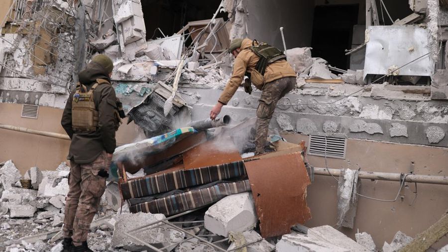 Ukrainian servicemen remove a grad rocket in a damaged house after an attack, amid Russia's invasion of Ukraine, in Kherson, Ukraine January 29, 2023. REUTERS/Nacho Doce