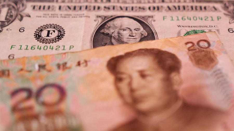 USA-CHINA/ U.S. Dollar and Chinese Yuan banknotes are seen in this illustration taken January 30, 2023. REUTERS/Dado Ruvic/Illustration