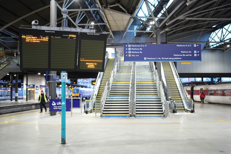 A commuter passes a closed entrance to London Victoria railway station during joint strike action by train drivers, teachers, university staff and civil servants, in London, UK, on Wednesday, Feb. 1, 2023. The day of coordinated industrial action is expected to be Britains most severe day of strikes for over a decade, piling pressure on Prime Minister Rishi Sunaks Conservative administration to resolve disputes with public sector workers by making more generous offers on pay. Photographer: Chris Ratcliffe/Bloomberg via Getty Images