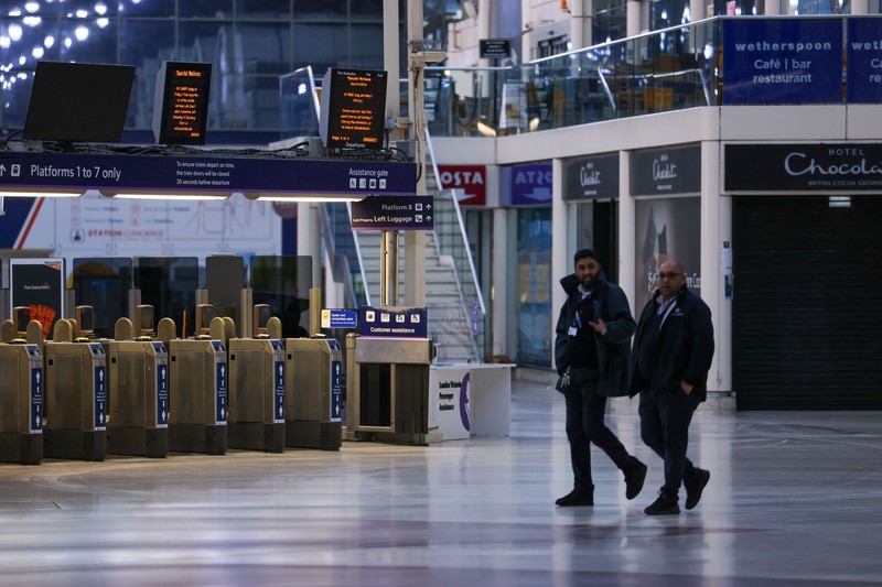 1246710070 A commuter passes a closed entrance to London Victoria railway station during joint strike action by train drivers, teachers, university staff and civil servants, in London, UK, on Wednesday, Feb. 1, 2023. The day of coordinated industrial action is expected to be Britains most severe day of strikes for over a decade, piling pressure on Prime Minister Rishi Sunaks Conservative administration to resolve disputes with public sector workers by making more generous offers on pay. Photographer: Chris Ratcliffe/Bloomberg via Getty Images
