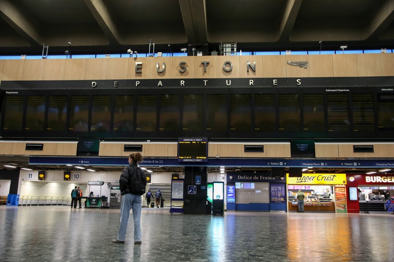 A commuter passes a closed entrance to London Victoria railway station during joint strike action by train drivers, teachers, university staff and civil servants, in London, UK, on Wednesday, Feb. 1, 2023. The day of coordinated industrial action is expected to be Britains most severe day of strikes for over a decade, piling pressure on Prime Minister Rishi Sunaks Conservative administration to resolve disputes with public sector workers by making more generous offers on pay. Photographer: Chris Ratcliffe/Bloomberg via Getty Images
