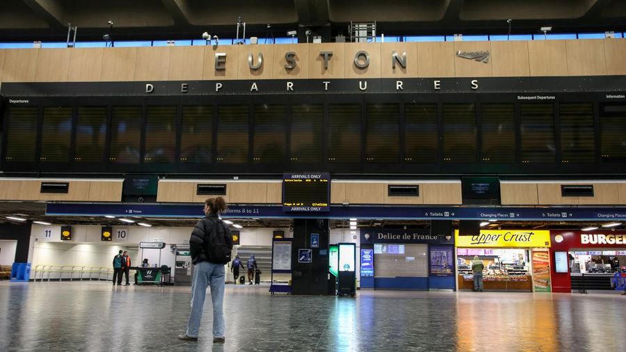 A commuter passes a closed entrance to London Victoria railway station during joint strike action by train drivers, teachers, university staff and civil servants, in London, UK, on Wednesday, Feb. 1, 2023. The day of coordinated industrial action is expected to be Britains most severe day of strikes for over a decade, piling pressure on Prime Minister Rishi Sunaks Conservative administration to resolve disputes with public sector workers by making more generous offers on pay. Photographer: Chris Ratcliffe/Bloomberg via Getty Images