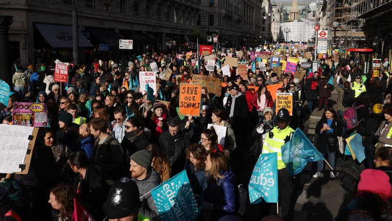 LONDON, ENGLAND - FEBRUARY 01:  Education workers gather in central London as they rally towards Westminster during a day of strikes across the UK on February 1, 2023 in London, United Kingdom. Public sector union members in education, the civil service and the Railways are taking part in strike action across the UK today. Teachers are walking out for the first time over pay and conditions joining 100,000 civil servants who are also seeking a pay rise. ASLEF and RMT train drivers are continuing a long-running strike and will also walk out on Friday. (Photo by Dan Kitwood/Getty Images)