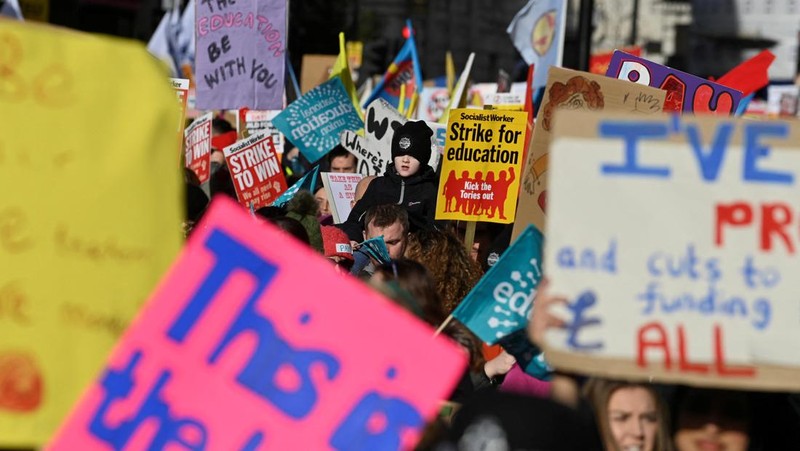 LONDON, ENGLAND - FEBRUARY 01:  Education workers gather in central London as they rally towards Westminster during a day of strikes across the UK on February 1, 2023 in London, United Kingdom. Public sector union members in education, the civil service and the Railways are taking part in strike action across the UK today. Teachers are walking out for the first time over pay and conditions joining 100,000 civil servants who are also seeking a pay rise. ASLEF and RMT train drivers are continuing a long-running strike and will also walk out on Friday. (Photo by Dan Kitwood/Getty Images)