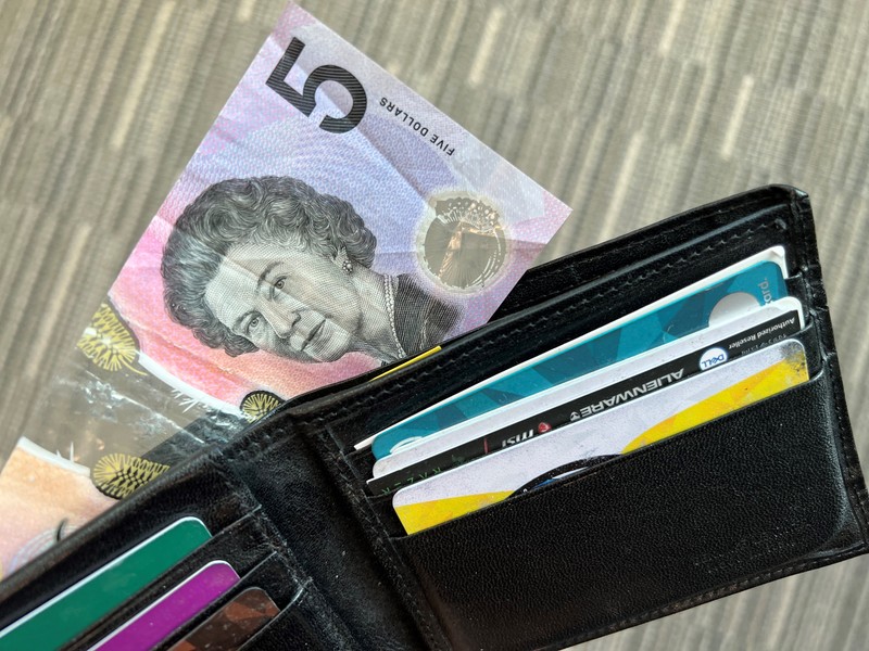 This photo illustration taken in Hong Kong on February 2, 2023 shows the Australian $5 banknote. - Australia's central bank announced on February 2, 2023 it will erase the British monarch from its banknotes, replacing the late Queen Elizabeth II's image on its $5 note with a design honouring Indigenous culture. (Photo by Mladen ANTONOV / AFP) (Photo by MLADEN ANTONOV/AFP via Getty Images)