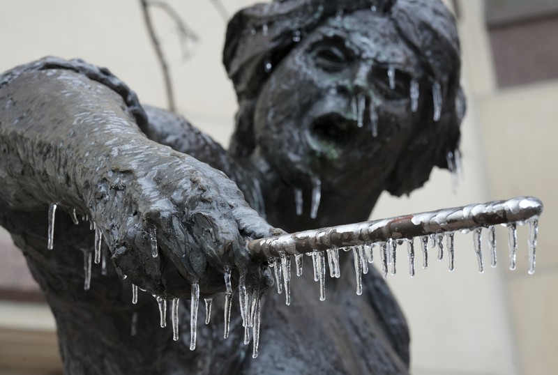 An icy mix covers the High Five Interchange at US 75 and I-635 on Tuesday, Jan. 31, 2023, in Dallas. Dallas and other parts of North Texas are under a winter storm warning that has been extended through Thursday. (Smiley N. Pool/The Dallas Morning News via AP)