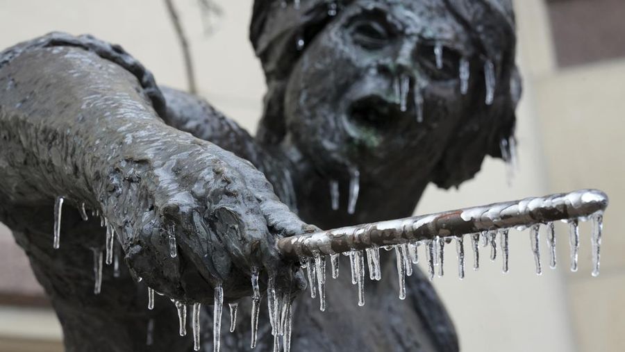 An icy mix covers the High Five Interchange at US 75 and I-635 on Tuesday, Jan. 31, 2023, in Dallas. Dallas and other parts of North Texas are under a winter storm warning that has been extended through Thursday. (Smiley N. Pool/The Dallas Morning News via AP)