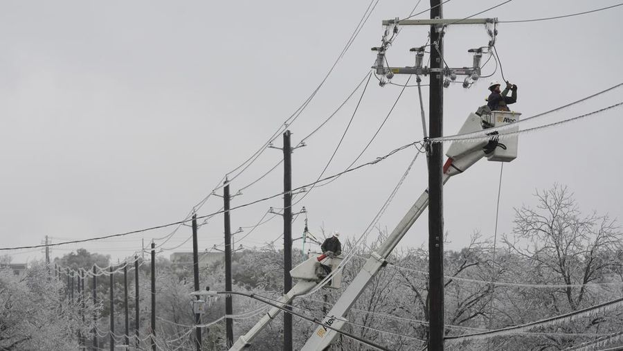 An icy mix covers the High Five Interchange at US 75 and I-635 on Tuesday, Jan. 31, 2023, in Dallas. Dallas and other parts of North Texas are under a winter storm warning that has been extended through Thursday. (Smiley N. Pool/The Dallas Morning News via AP)