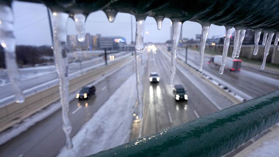 An icy mix covers the High Five Interchange at US 75 and I-635 on Tuesday, Jan. 31, 2023, in Dallas. Dallas and other parts of North Texas are under a winter storm warning that has been extended through Thursday. (Smiley N. Pool/The Dallas Morning News via AP)