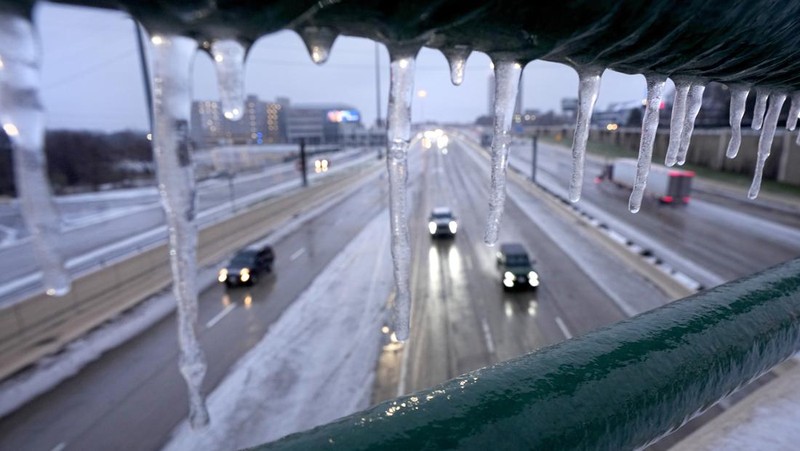 An icy mix covers the High Five Interchange at US 75 and I-635 on Tuesday, Jan. 31, 2023, in Dallas. Dallas and other parts of North Texas are under a winter storm warning that has been extended through Thursday. (Smiley N. Pool/The Dallas Morning News via AP)