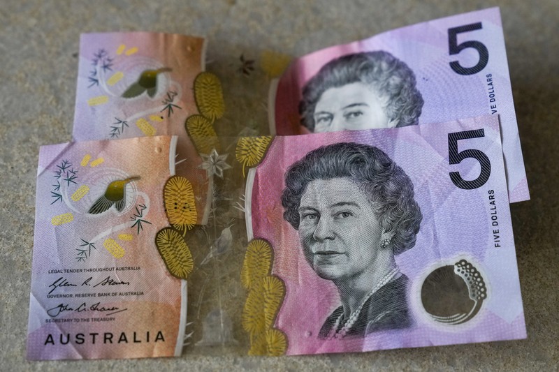 This photo illustration taken in Hong Kong on February 2, 2023 shows the Australian $5 banknote. - Australia's central bank announced on February 2, 2023 it will erase the British monarch from its banknotes, replacing the late Queen Elizabeth II's image on its $5 note with a design honouring Indigenous culture. (Photo by Mladen ANTONOV / AFP) (Photo by MLADEN ANTONOV/AFP via Getty Images)