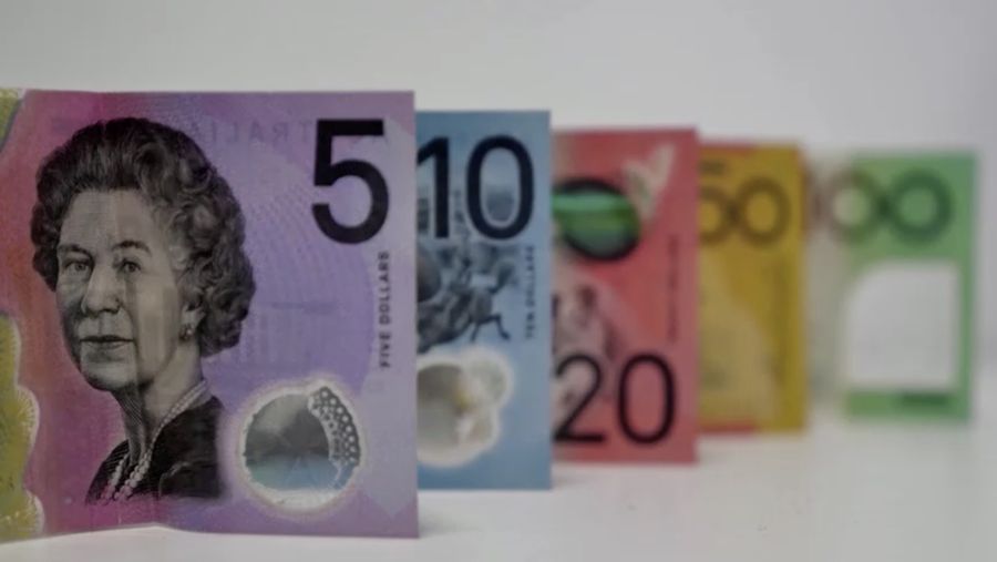 This photo illustration taken in Hong Kong on February 2, 2023 shows the Australian $5 banknote. - Australia's central bank announced on February 2, 2023 it will erase the British monarch from its banknotes, replacing the late Queen Elizabeth II's image on its $5 note with a design honouring Indigenous culture. (Photo by Mladen ANTONOV / AFP) (Photo by MLADEN ANTONOV/AFP via Getty Images)