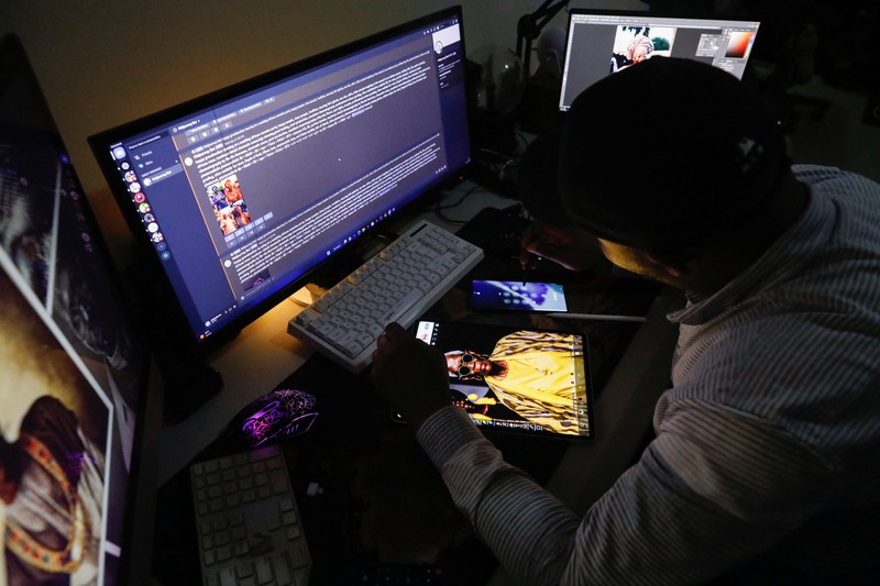 NIGERIA-ART/AI Nigerian artist Malik Afegbua creates hyper-realistic pictures of African elderly people, using artificial intelligence, at his home in Lagos, Nigeria January 25, 2023. REUTERS/Temilade Adelaja