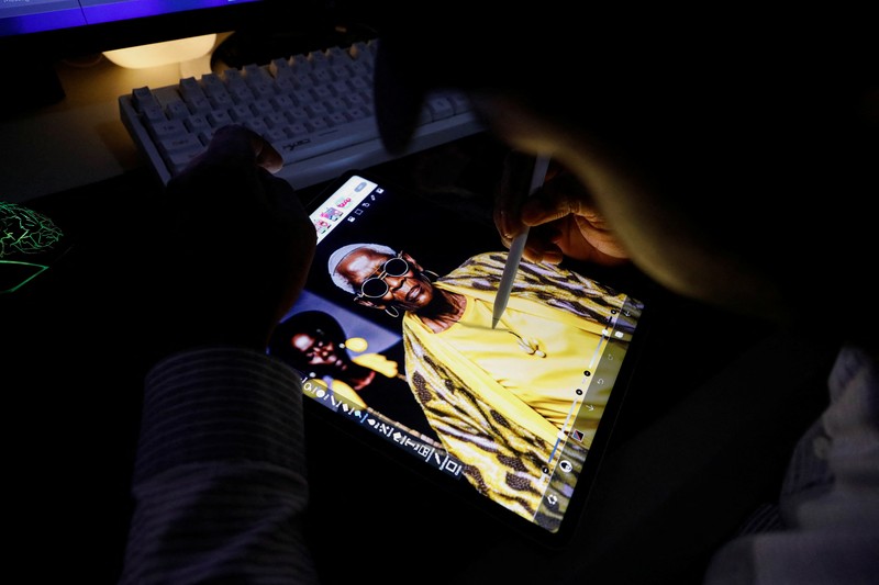 Nigerian artist Malik Afegbua creates hyper-realistic pictures of African elderly people, using artificial intelligence, at his home in Lagos, Nigeria January 25, 2023. REUTERS/Temilade Adelaja