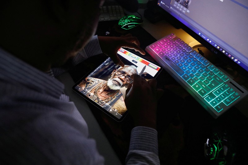 NIGERIA-ART/AI Nigerian artist Malik Afegbua creates hyper-realistic pictures of African elderly people, using artificial intelligence, at his home in Lagos, Nigeria January 25, 2023. REUTERS/Temilade Adelaja