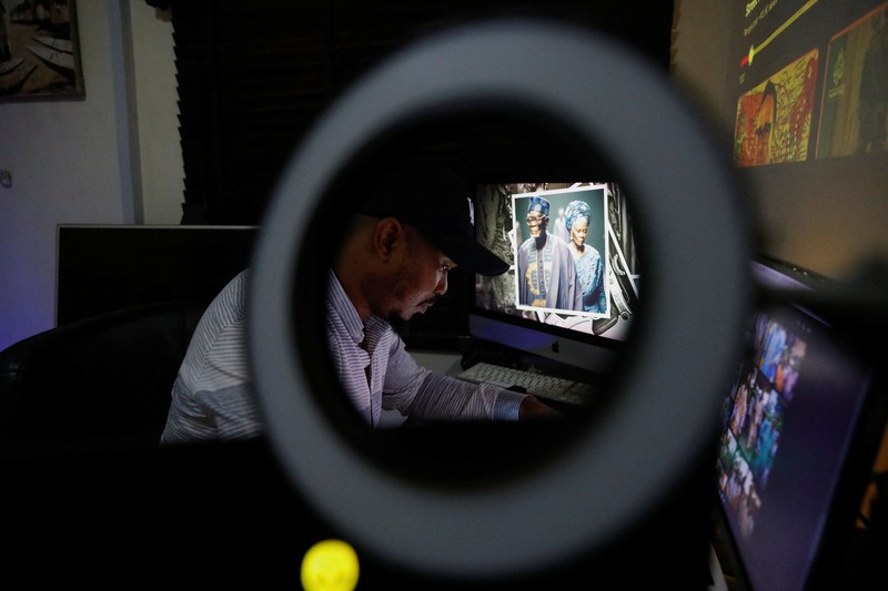 NIGERIA-ART/AI Nigerian artist Malik Afegbua creates hyper-realistic pictures of African elderly people, using artificial intelligence, at his home in Lagos, Nigeria January 25, 2023. REUTERS/Temilade Adelaja