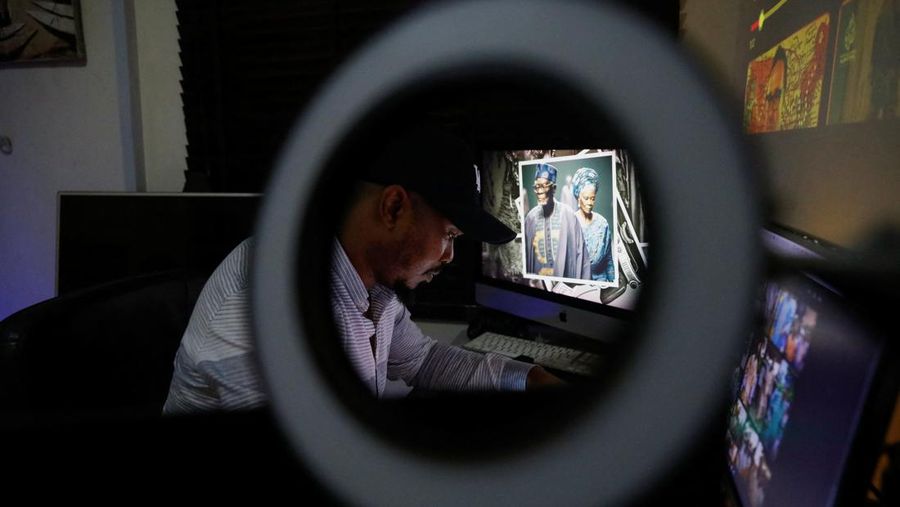 Nigerian artist Malik Afegbua creates hyper-realistic pictures of African elderly people, using artificial intelligence, at his home in Lagos, Nigeria January 25, 2023. REUTERS/Temilade Adelaja