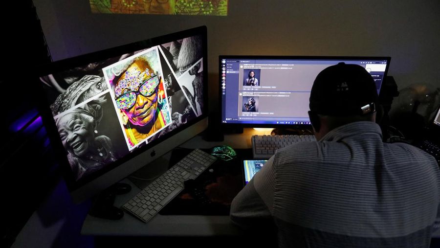 Nigerian artist Malik Afegbua creates hyper-realistic pictures of African elderly people, using artificial intelligence, at his home in Lagos, Nigeria January 25, 2023. REUTERS/Temilade Adelaja