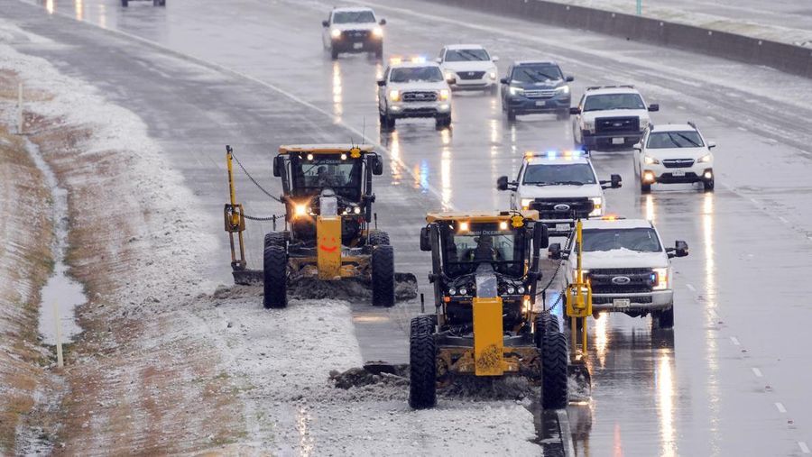 An icy mix covers the High Five Interchange at US 75 and I-635 on Tuesday, Jan. 31, 2023, in Dallas. Dallas and other parts of North Texas are under a winter storm warning that has been extended through Thursday. (Smiley N. Pool/The Dallas Morning News via AP)