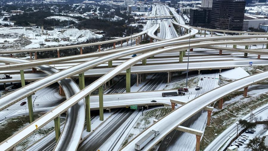 An icy mix covers the High Five Interchange at US 75 and I-635 on Tuesday, Jan. 31, 2023, in Dallas. Dallas and other parts of North Texas are under a winter storm warning that has been extended through Thursday. (Smiley N. Pool/The Dallas Morning News via AP)