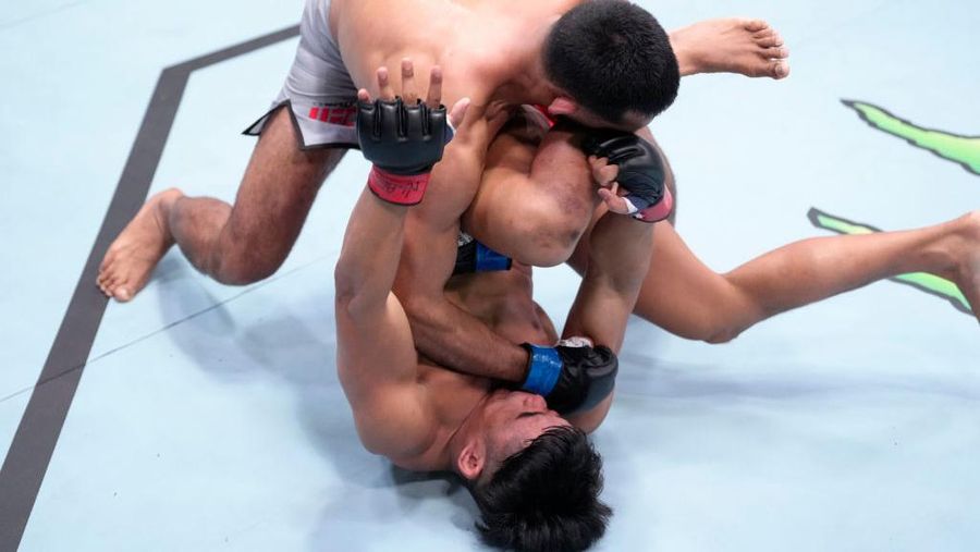 LAS VEGAS, NEVADA - FEBRUARY 04: (L-R) Anshul Jubli of India punches Jeka Saragih of Indonesia in a lightweight fight during the UFC Fight Night event at UFC APEX on February 04, 2023 in Las Vegas, Nevada. (Photo by Jeff Bottari/Zuffa LLC via Getty Images)