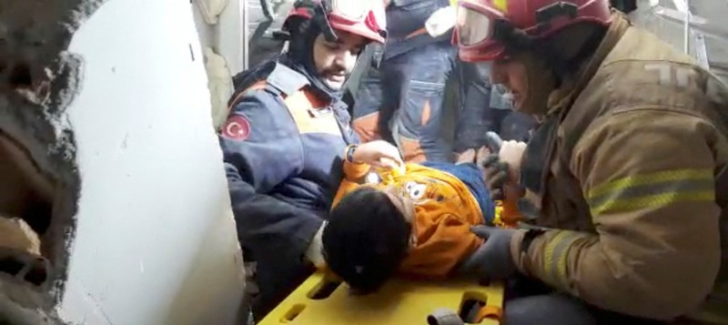 TURKEY-QUAKE/SYRIA-AZMARIN RESCUE A child is rescued from the rubble in the aftermath of an earthquake in Azmarin, Syria, February 7, 2023 in this still image taken from video. White Helmets/Handout via REUTERS THIS IMAGE HAS BEEN SUPPLIED BY A THIRD PARTY. NO RESALES. NO ARCHIVES. MANDATORY CREDIT