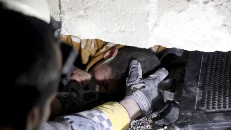 TURKEY-QUAKE/SYRIA-AZMARIN RESCUE A child is rescued from the rubble in the aftermath of an earthquake in Azmarin, Syria, February 7, 2023 in this still image taken from video. White Helmets/Handout via REUTERS THIS IMAGE HAS BEEN SUPPLIED BY A THIRD PARTY. NO RESALES. NO ARCHIVES. MANDATORY CREDIT
