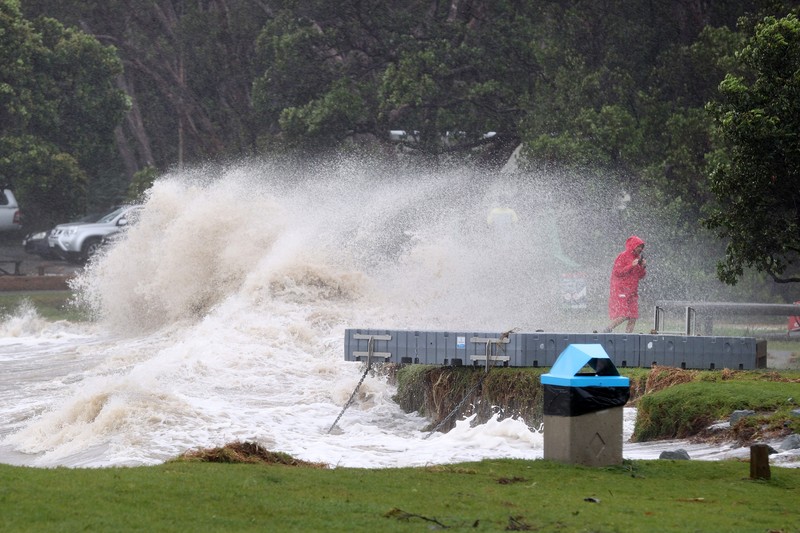 AUCKLAND, NEW ZEALAND - FEBRUARY 13: People out looking at the effects of Cyclone Gabrielle at Mathesons Bay Beach on the Matakana Coast on February 13, 2023 in Auckland, New Zealand. Forecasters say Auckland residents are about halfway through the cyclone impacts, with a better weather forecast from Wednesday. (Photo by Fiona Goodall/Getty Images) on February 13, 2023 in Auckland, New Zealand.  (Photo by Fiona Goodall/Getty Images)