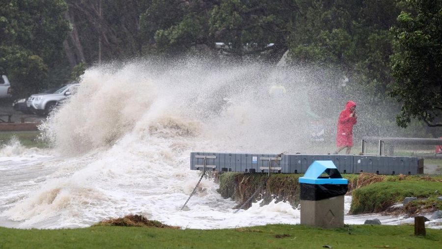 AUCKLAND, NEW ZEALAND - FEBRUARY 13: People out looking at the effects of Cyclone Gabrielle at Mathesons Bay Beach on the Matakana Coast on February 13, 2023 in Auckland, New Zealand. Forecasters say Auckland residents are about halfway through the cyclone impacts, with a better weather forecast from Wednesday. (Photo by Fiona Goodall/Getty Images) on February 13, 2023 in Auckland, New Zealand.  (Photo by Fiona Goodall/Getty Images)