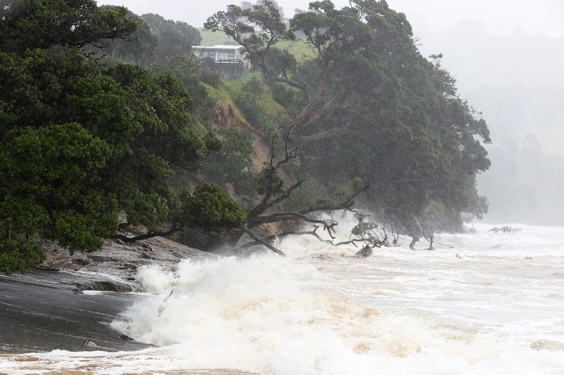 1465425529 AUCKLAND, NEW ZEALAND - FEBRUARY 13: People out looking at the effects of Cyclone Gabrielle at Mathesons Bay Beach on the Matakana Coast on February 13, 2023 in Auckland, New Zealand. Forecasters say Auckland residents are about halfway through the cyclone impacts, with a better weather forecast from Wednesday. (Photo by Fiona Goodall/Getty Images) on February 13, 2023 in Auckland, New Zealand. (Photo by Fiona Goodall/Getty Images)