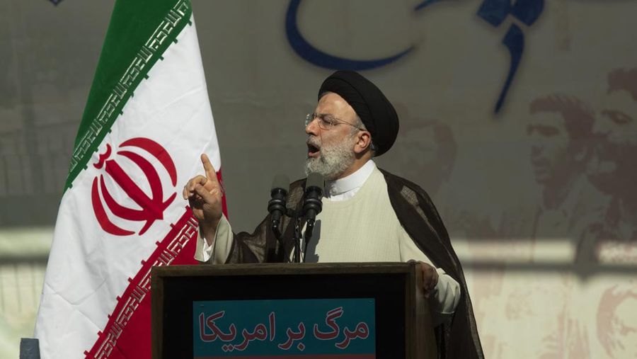 TEHRAN, IRAN - NOVEMBER 04: Iran's President Ebrahim Raisi speaks during a rally outside the former US embassy in the capital Tehran on November 4, 2022 in Tehran, Iran. On November 4, 1979, more than 50 United States diplomats and citizens were held hostage after a group of militarized Iranian students stormed the US embassy in Tehran. The embassy takeover triggered a 444-day hostage crisis and break in diplomatic relations that continues to this day.  (Photo by Contributor#072019/Getty Images)