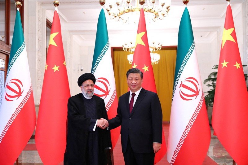 Iranian President Ebrahim Raisi stands next to Chinese President Xi Jinping during a welcoming ceremony in Beijing, China, February 14, 2023. Iran's President Website/WANA (West Asia News Agency)/Handout via REUTERS. ATTENTION EDITORS - THIS PICTURE WAS PROVIDED BY A THIRD PARTY.