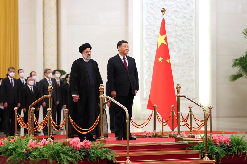 Iranian President Ebrahim Raisi stands next to Chinese President Xi Jinping during a welcoming ceremony in Beijing, China, February 14, 2023. Iran's President Website/WANA (West Asia News Agency)/Handout via REUTERS. ATTENTION EDITORS - THIS PICTURE WAS PROVIDED BY A THIRD PARTY.