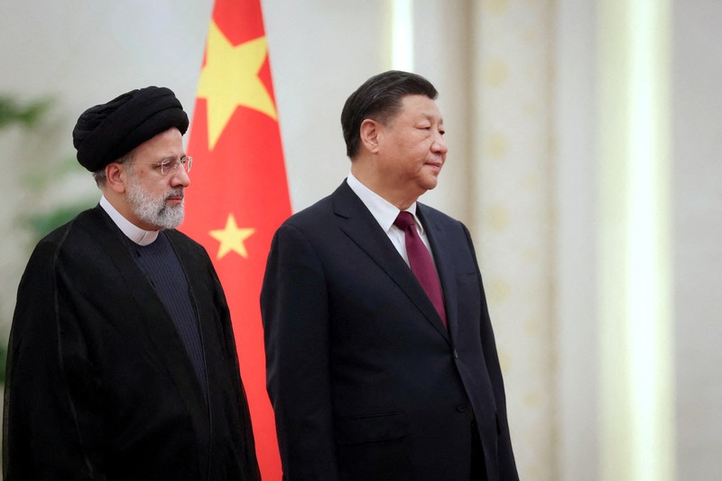Iranian President Ebrahim Raisi stands next to Chinese President Xi Jinping during a welcoming ceremony in Beijing, China, February 14, 2023. Iran's President Website/WANA (West Asia News Agency)/Handout via REUTERS. ATTENTION EDITORS - THIS PICTURE WAS PROVIDED BY A THIRD PARTY.