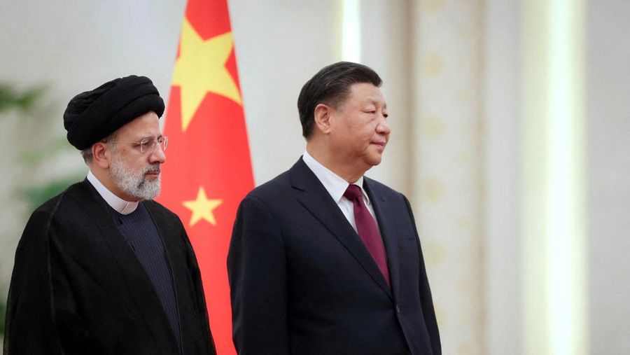 Iranian President Ebrahim Raisi stands next to Chinese President Xi Jinping during a welcoming ceremony in Beijing, China, February 14, 2023. Iran's President Website/WANA (West Asia News Agency)/Handout via REUTERS. ATTENTION EDITORS - THIS PICTURE WAS PROVIDED BY A THIRD PARTY.