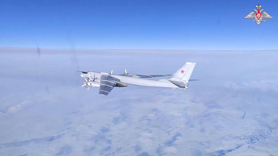 A Russian Tu-95MS strategic bomber performs a flight over the neutral waters of the Bering Sea, in this still image taken from a handout video released February 14, 2023. Russian Defence Ministry/Handout via REUTERS ATTENTION EDITORS - THIS IMAGE WAS PROVIDED BY A THIRD PARTY. NO RESALES. NO ARCHIVES. MANDATORY CREDIT.