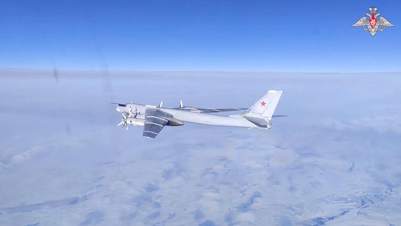 A Russian Tu-95MS strategic bomber performs a flight over the neutral waters of the Bering Sea, in this still image taken from a handout video released February 14, 2023. Russian Defence Ministry/Handout via REUTERS ATTENTION EDITORS - THIS IMAGE WAS PROVIDED BY A THIRD PARTY. NO RESALES. NO ARCHIVES. MANDATORY CREDIT.