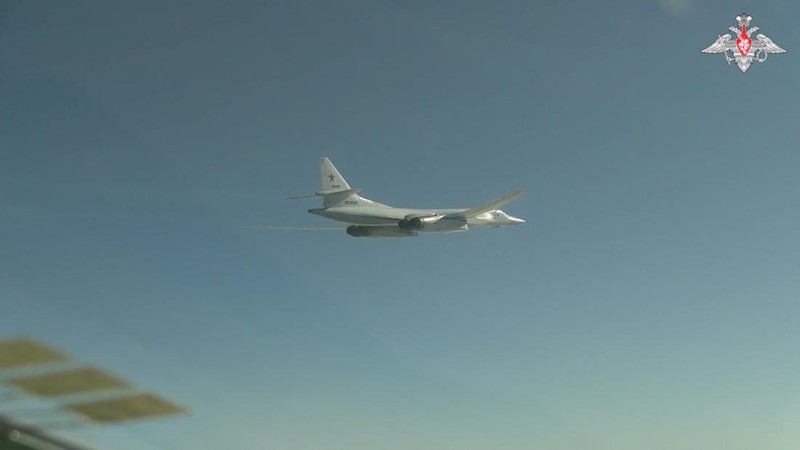 A Russian Tu-95MS strategic bomber performs a flight over the neutral waters of the Bering Sea, in this still image taken from a handout video released February 14, 2023. Russian Defence Ministry/Handout via REUTERS ATTENTION EDITORS - THIS IMAGE WAS PROVIDED BY A THIRD PARTY. NO RESALES. NO ARCHIVES. MANDATORY CREDIT.
