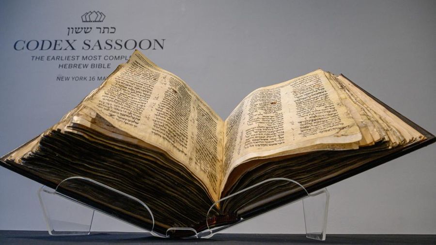 NEW YORK, NEW YORK - FEBRUARY 15:  A view of the Codex Sassoon at Sotheby's on February 15, 2023 in New York City. The codex is the oldest surviving Hebrew Bible or Tanakh as its used today in contrast to the dead sea scrolls which are older but the books are in separate scrolls. The Book is approximately 1000 years old and is estimated to be auctioned at 30-50 Million dollars and that would make it the most valuable historical document to appear in auction. (Photo by Roy Rochlin/Getty Images)