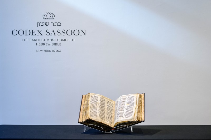 NEW YORK, NEW YORK - FEBRUARY 15:  A view of the Codex Sassoon at Sotheby's on February 15, 2023 in New York City. The codex is the oldest surviving Hebrew Bible or Tanakh as its used today in contrast to the dead sea scrolls which are older but the books are in separate scrolls. The Book is approximately 1000 years old and is estimated to be auctioned at 30-50 Million dollars and that would make it the most valuable historical document to appear in auction. (Photo by Roy Rochlin/Getty Images)