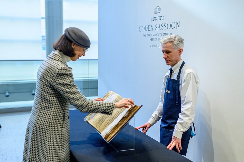 NEW YORK, NEW YORK - FEBRUARY 15:  A view of the Codex Sassoon at Sotheby's on February 15, 2023 in New York City. The codex is the oldest surviving Hebrew Bible or Tanakh as its used today in contrast to the dead sea scrolls which are older but the books are in separate scrolls. The Book is approximately 1000 years old and is estimated to be auctioned at 30-50 Million dollars and that would make it the most valuable historical document to appear in auction. (Photo by Roy Rochlin/Getty Images)